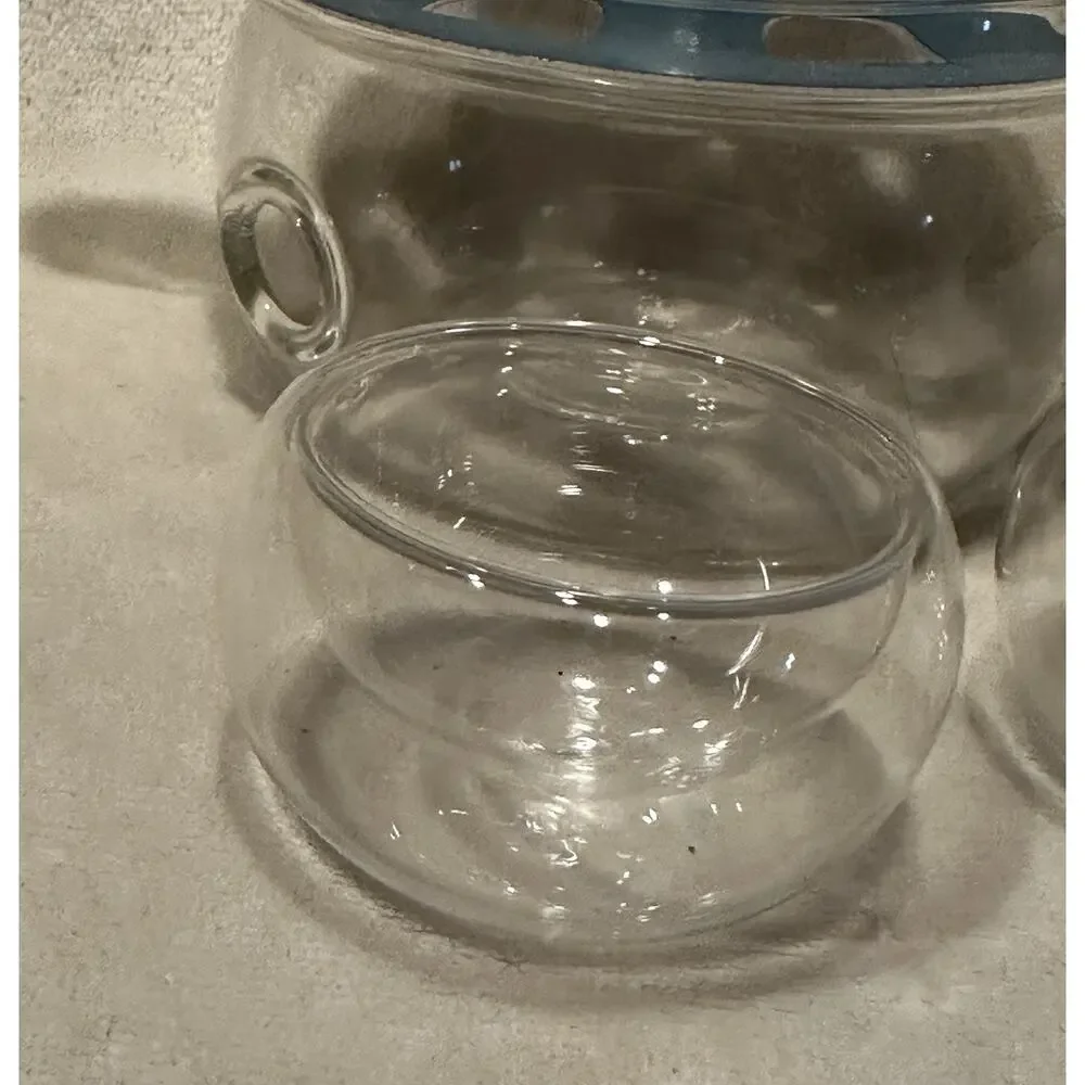 Shou Gong 27 oz glass filtering tea maker teapot with a warmer and 6 tea cups